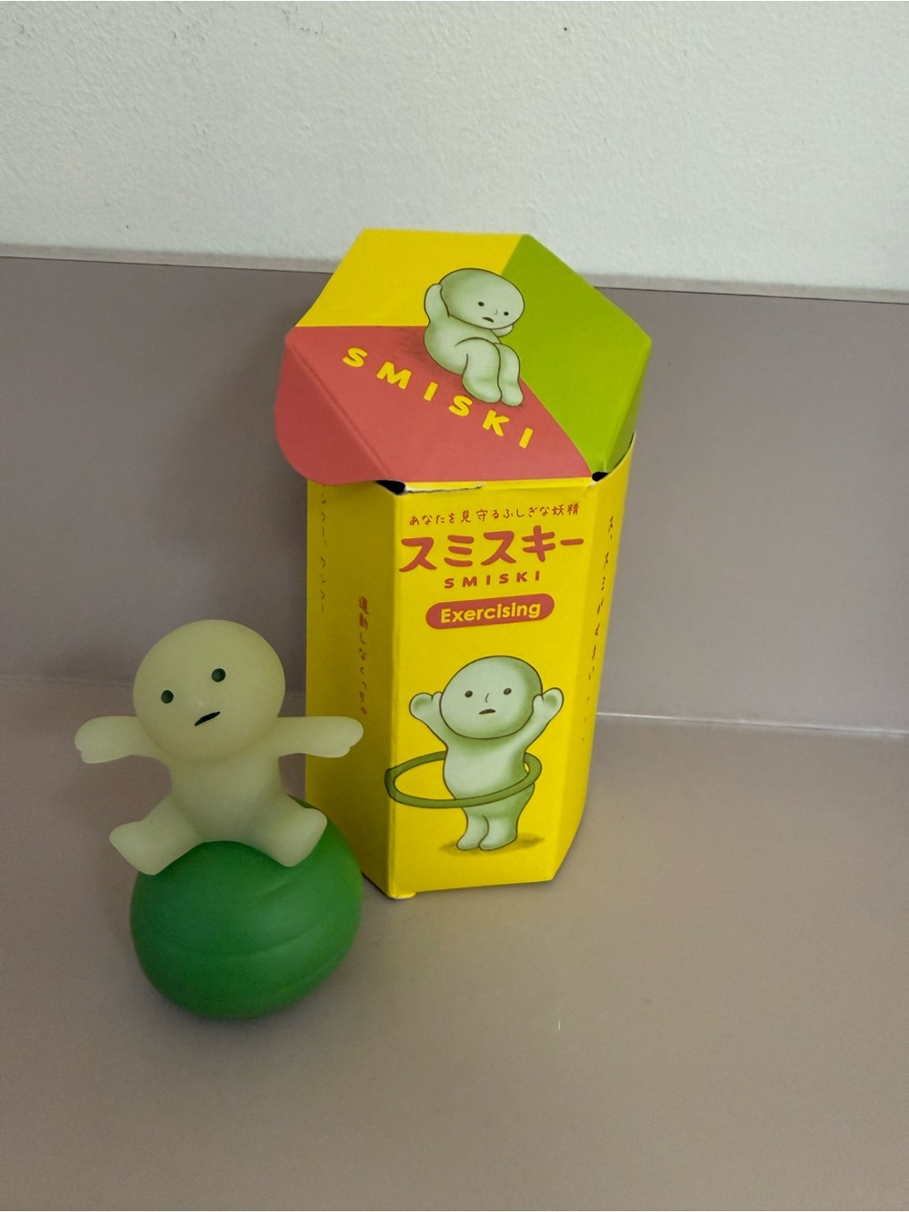 Exercising Glow Figure on Green Ball -
